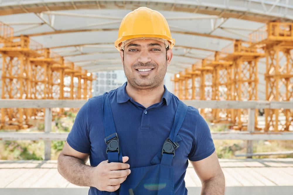 Smiling contractor in a hard hat